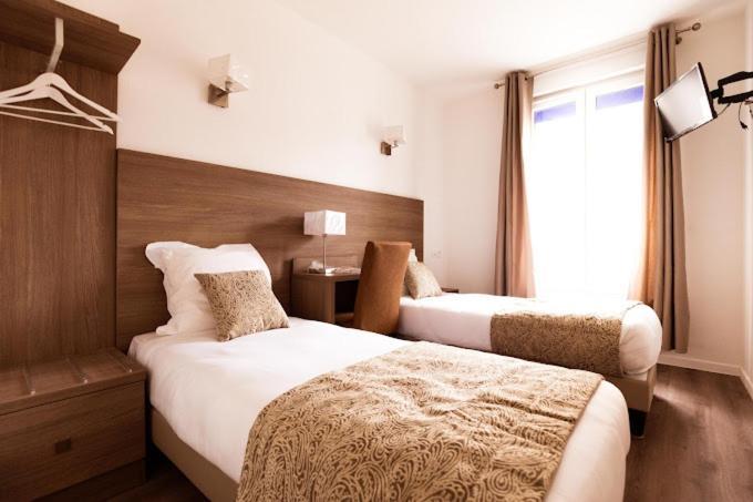 Le Theatre Hotel Suresnes Bagian luar foto